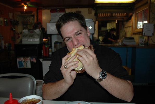 Joe, eating a Texas-shaped burger at Arnold Burger, in Amarillo, TX